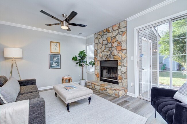Building Photo - Discover this beautifully updated Raintree townhome featuring an open floor plan and a range of c...