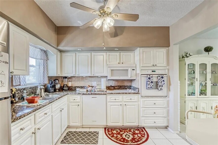 Kitchen is equipped with refrigerator, ice maker, stove, oven, microwave, dishwasher - 2460 Franciscan Dr
