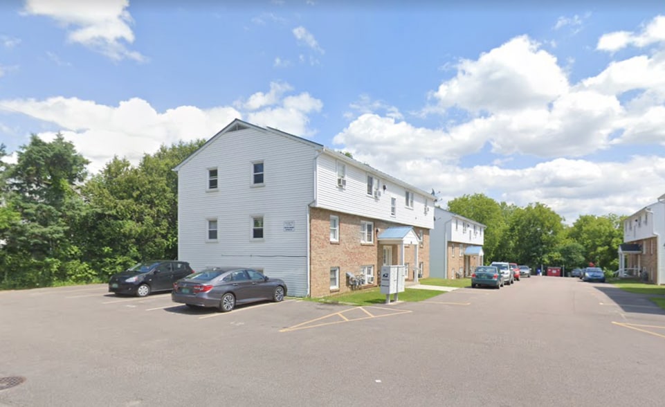 119 Main Street 4A outside, with covered front entrance. Tenants are guaranteed one parking spot next to unit, and spot(s) in the rear of association lot. - 119 Main St