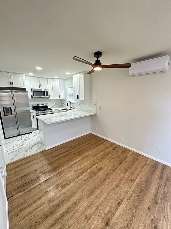 Building Photo - Remodeled 2 Story 3BR/2BA House with Vinyl plank flooring, Fenced backyard & 2 Car garage and more!
