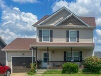 Building Photo - Single-Family with a Fenced Backyard!