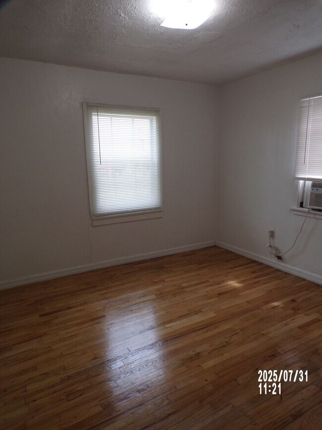 Building Photo - NEW listing-refinished hardwood floors, new laminate and paint throughout