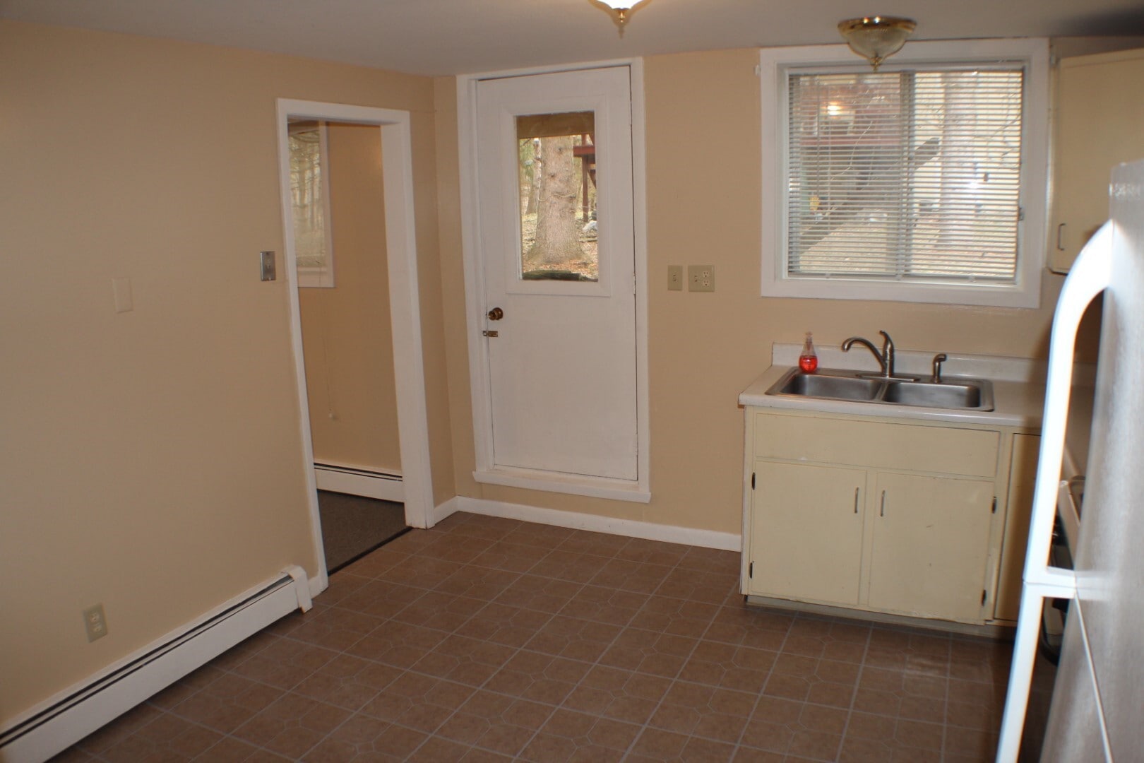 Kitchen and back door to yard - 120 Sapsucker Woods Road