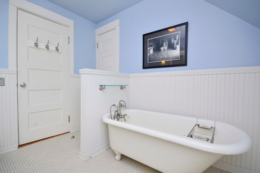 East facing bathroom with clawfoot tub and hand shower, and linen closet; spacious room! - 1228 Forest Ave