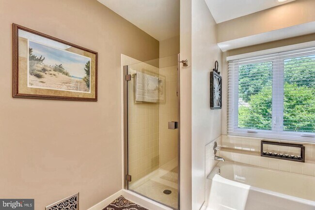 Building Photo - Experience elevated living in this beautifully renovated townhome nestled within the highly sough...