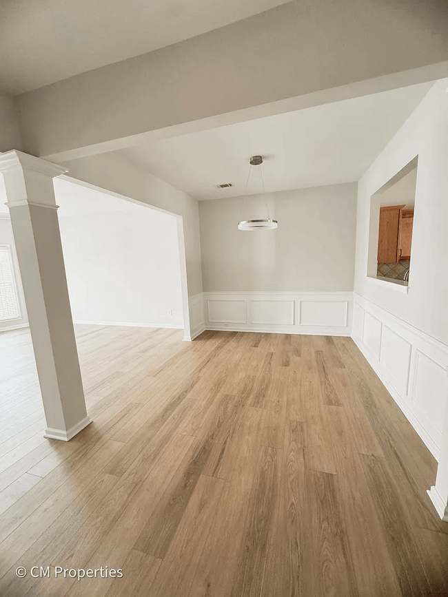 Dining area with opening into kitchen. - 3968 Boston Common St