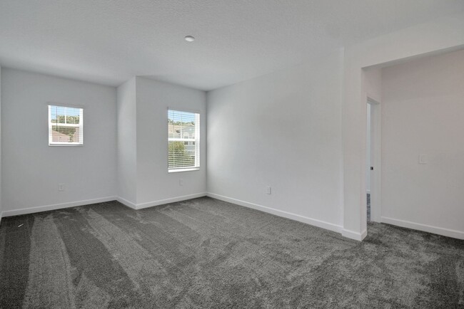 Building Photo - Stunning 4/3 in Gated Dora Parc! Water Views!