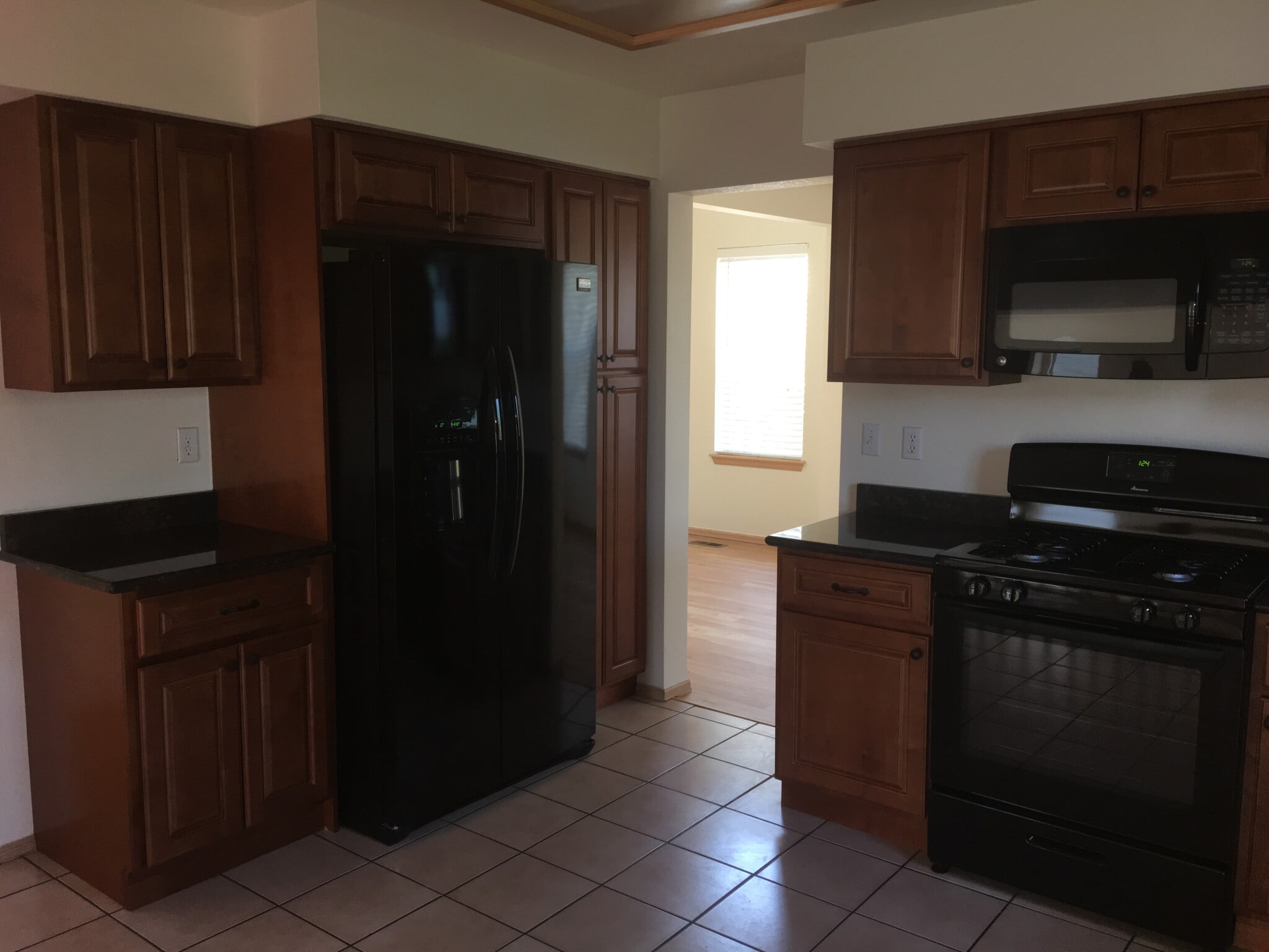 Kitchen with granite counter tops and new appliances - 10710 Kimball St