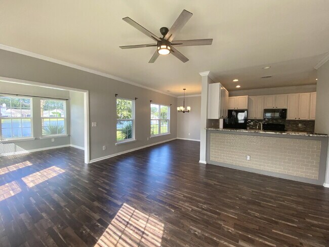 Building Photo - Three Bedroom Home with fenced-in Backyard...