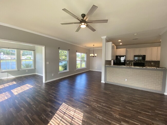 Building Photo - Three Bedroom Home with fenced-in Backyard oasis!