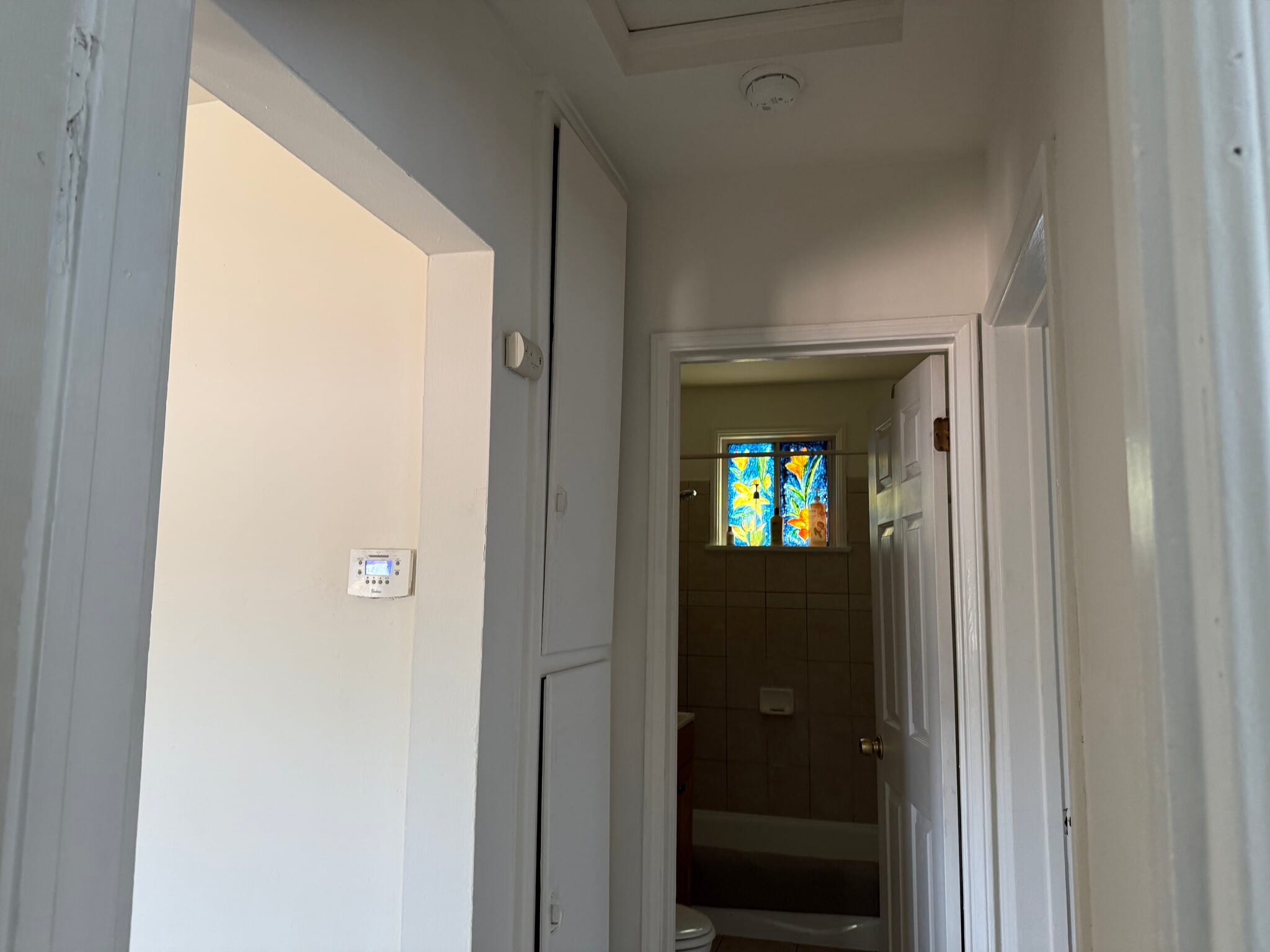 Hallway with linen cabinets. - 10324 Hillhaven Ave