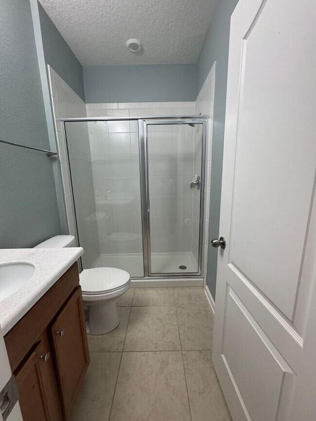 Building Photo - COMING SOON! Beautiful 4BR 3BA Home w/ Screened Lanai & Pond View • Garage Parking • Fenced Yard ...