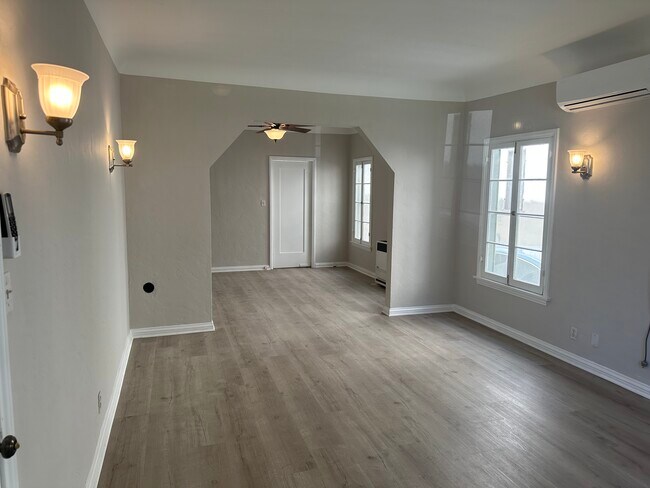 Living room with dining area - 2053 N Raymond Ave