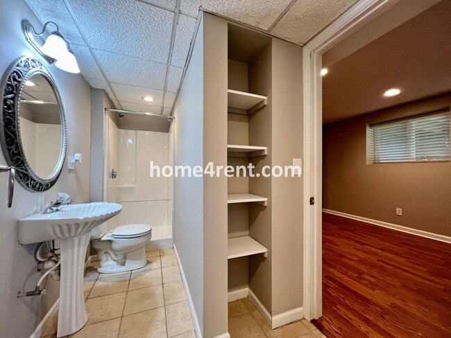 Building Photo - Updated Kitchen, Large Two Tiered Deck, Finished Basement in Blue Valley Schools!