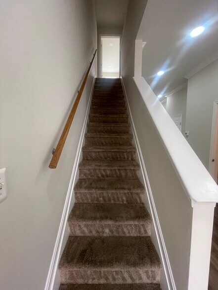 Stairs to upstairs - 112 S Haven St