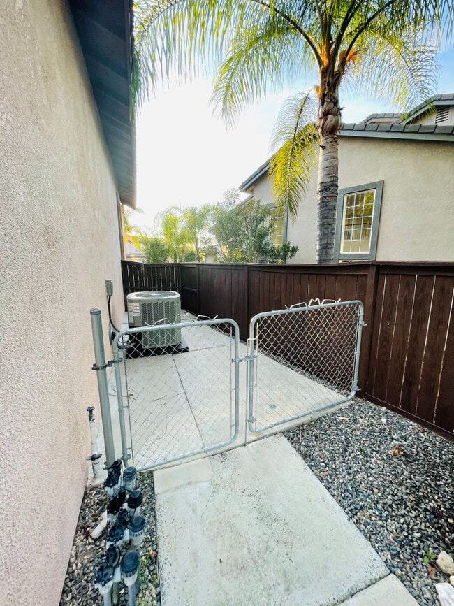 Building Photo - 42020 Dahlia Way