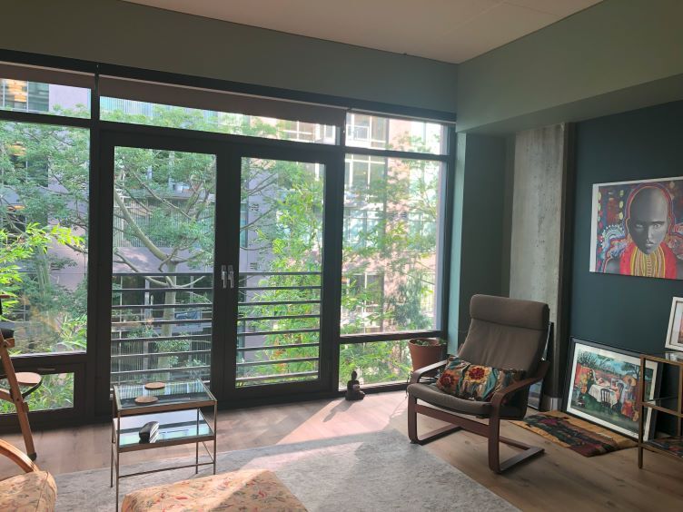open concept living room with Juliette balcony doors - 1111 S Grand Ave