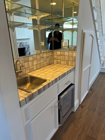 Wet bar with wine refrigerator... - 2220 Curtis Ave