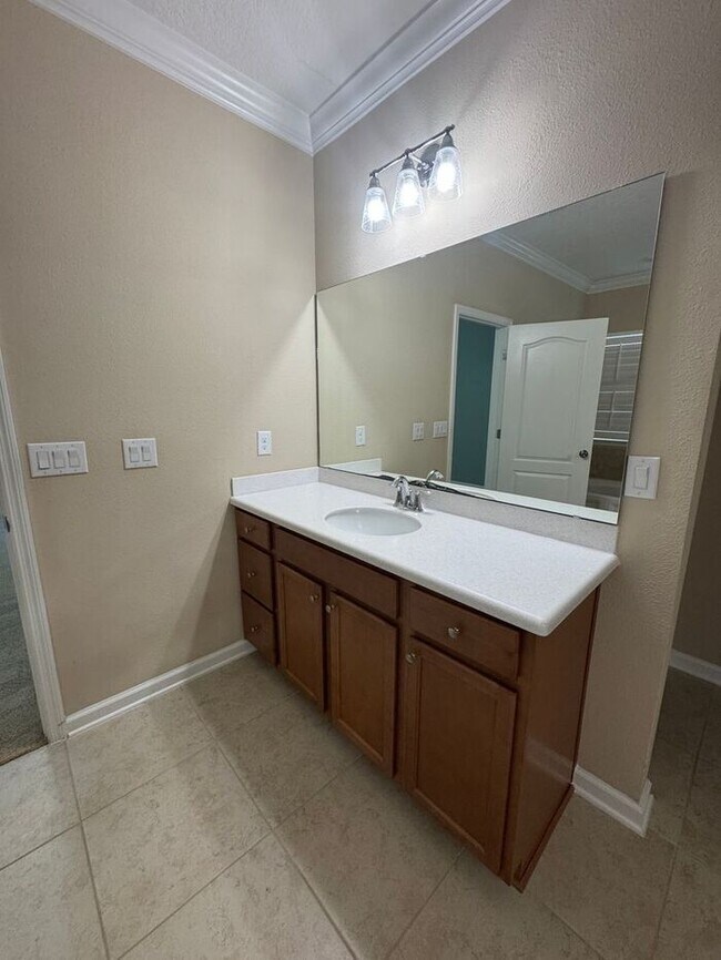 Building Photo - COMING SOON! Beautiful 4BR 3BA Home w/ Screened Lanai & Pond View • Garage Parking • Fenced Yard ...