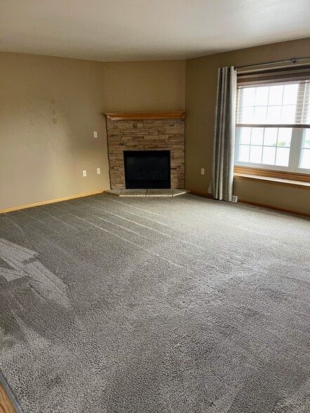 Open floor concept living room with an electric fireplace - 2216 Patrick Ln