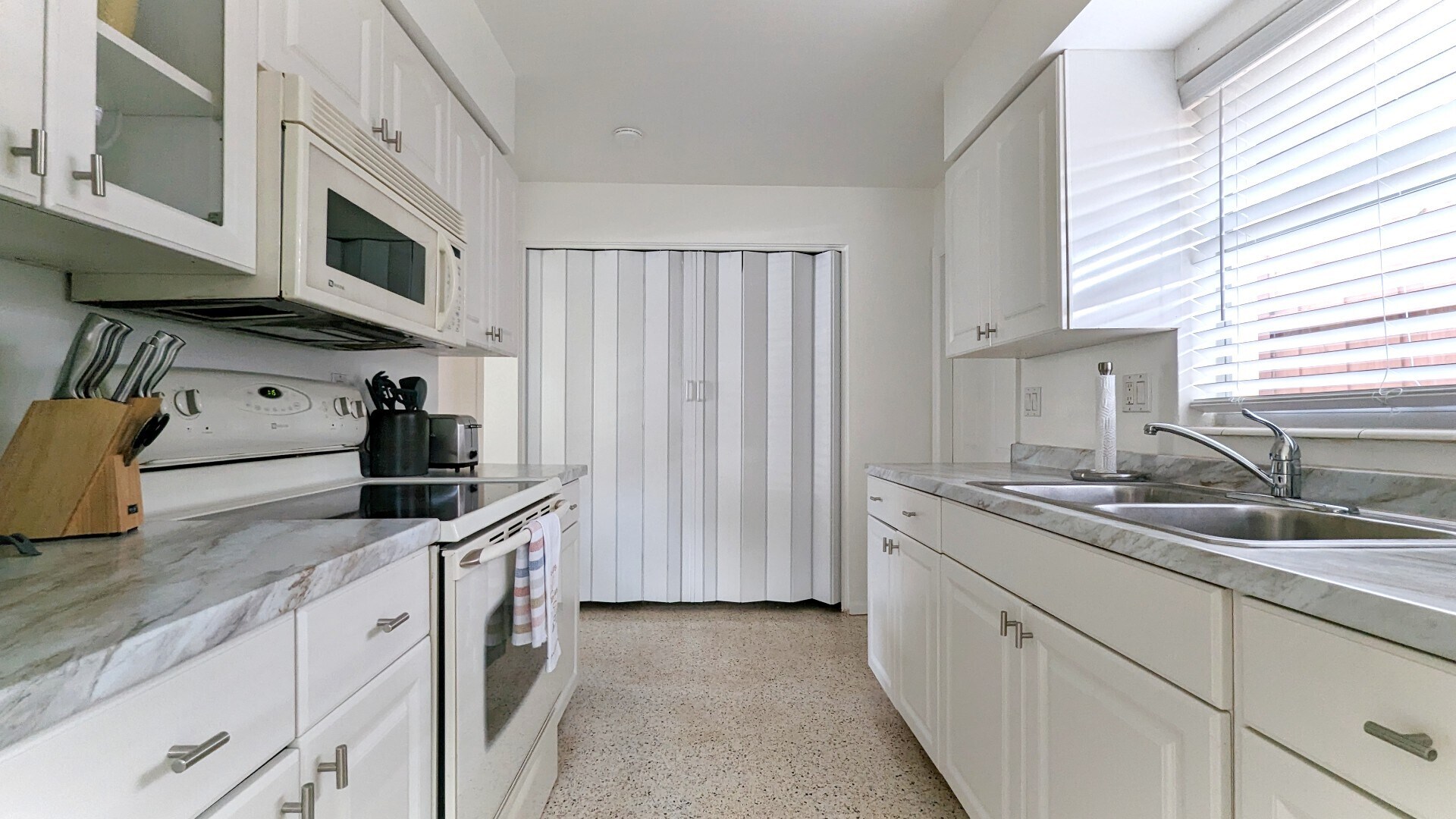Kitchen with washer dryer hidden from view - 2846 W Tamiami Cir