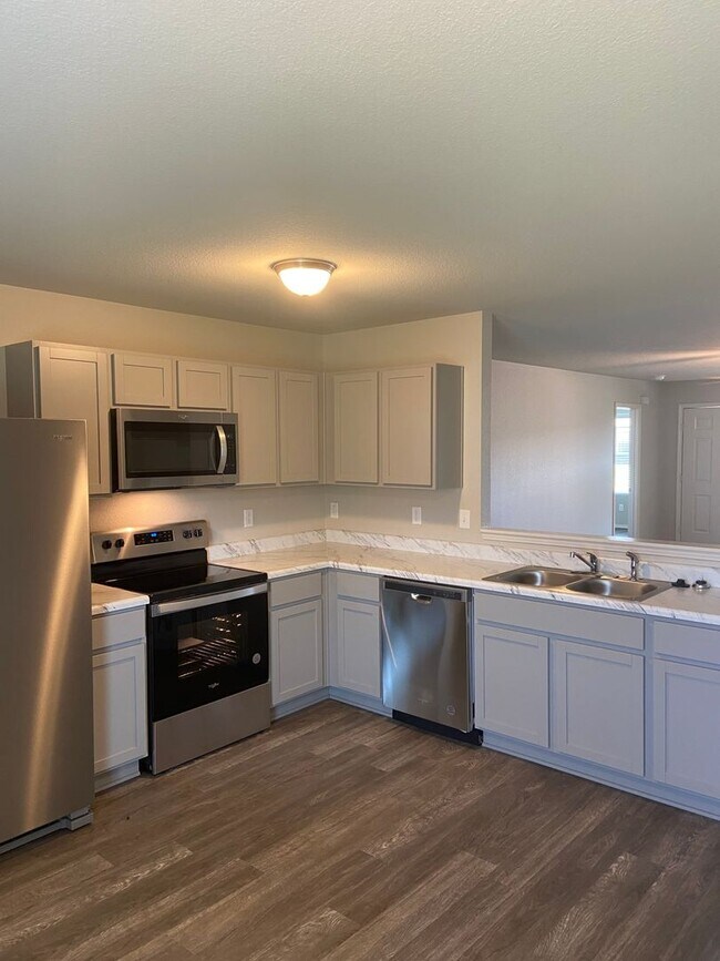 Building Photo - Comfort & Space in Conrad Court — 4-Bed, 2-Bath Home Available Now