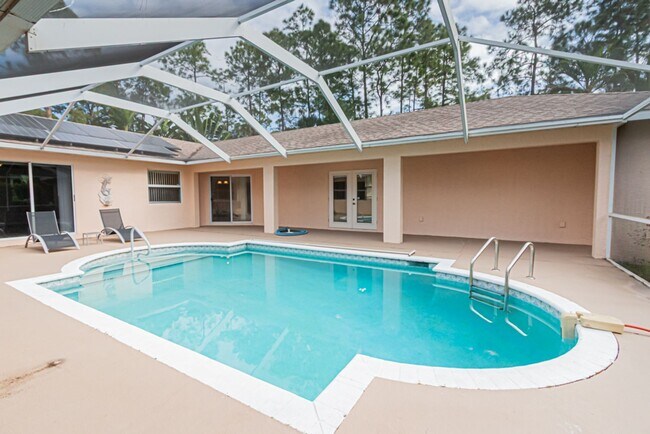Building Photo - 5-Bed Home With Private Heated Pool & Large Yard - Pet Friendly!