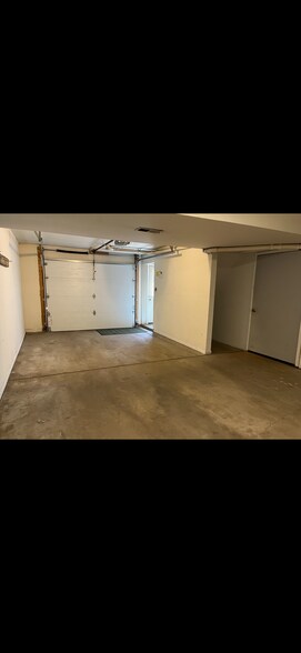 Garage with laundry & storage. - 1583 highland park dr