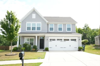 Building Photo - This wonderful home has a covered rocking ...
