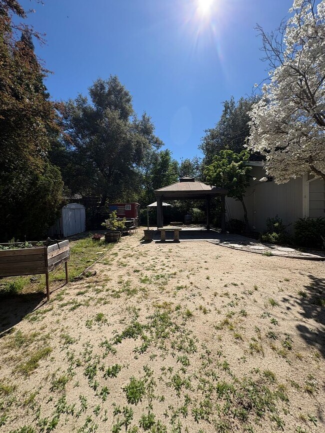 Building Photo - Your Private Escape – Charming Ranch-Style Home with Room to Breathe!