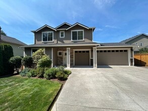 Building Photo - 4 bed/2.5 bath and 3 car garage and a down...