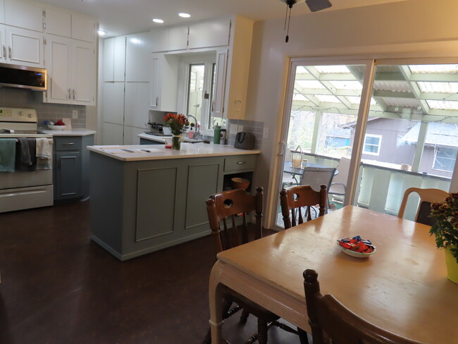 Dining Area with Slider Door to Covered Deck - 2940 Okemos Dr SE