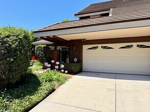 Building Photo - Private Oasis with Sunroom, Balcony & Lush Landscaping | 4BR Home Near Community Pool & Spa