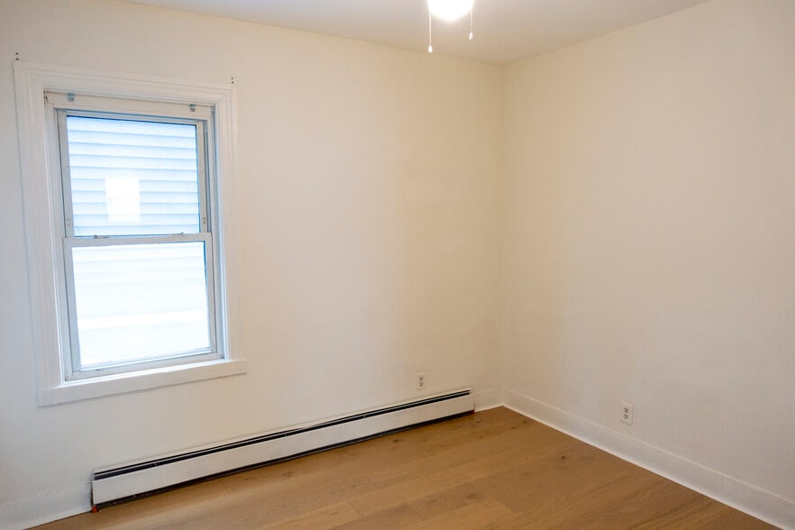 Second bedroom, also with newly installed hardwood floors. - 30 Royal St