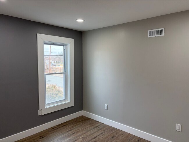 Building Photo - Newly Renovated 2- Story Townhome with Front Porch and Back Yard