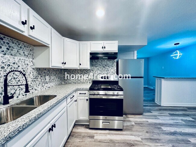 Building Photo - Lovely Three Bedroom Home in KCMO and an Updated Kitchen  w/ Granite and SS Appliances, including...