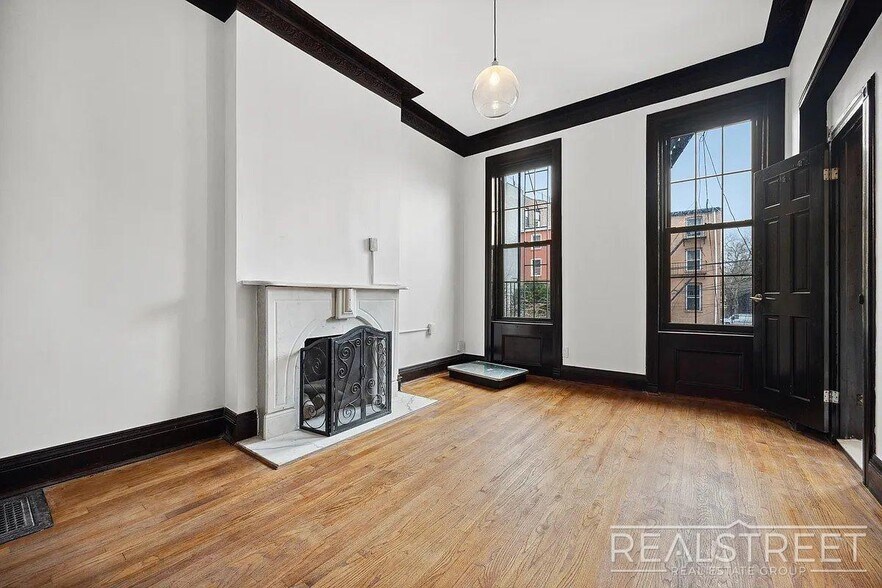 Building Photo - Timelessly Renovated Historic Triplex with...