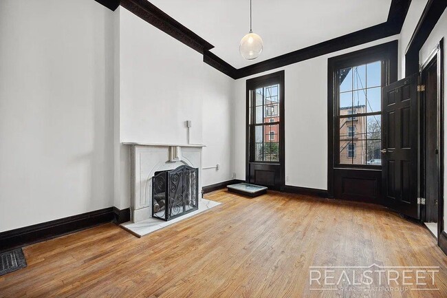 Building Photo - Timelessly Renovated Historic Triplex with...