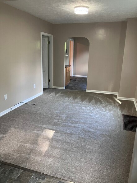 living room looking into kitchen - 372 N Madison Ave
