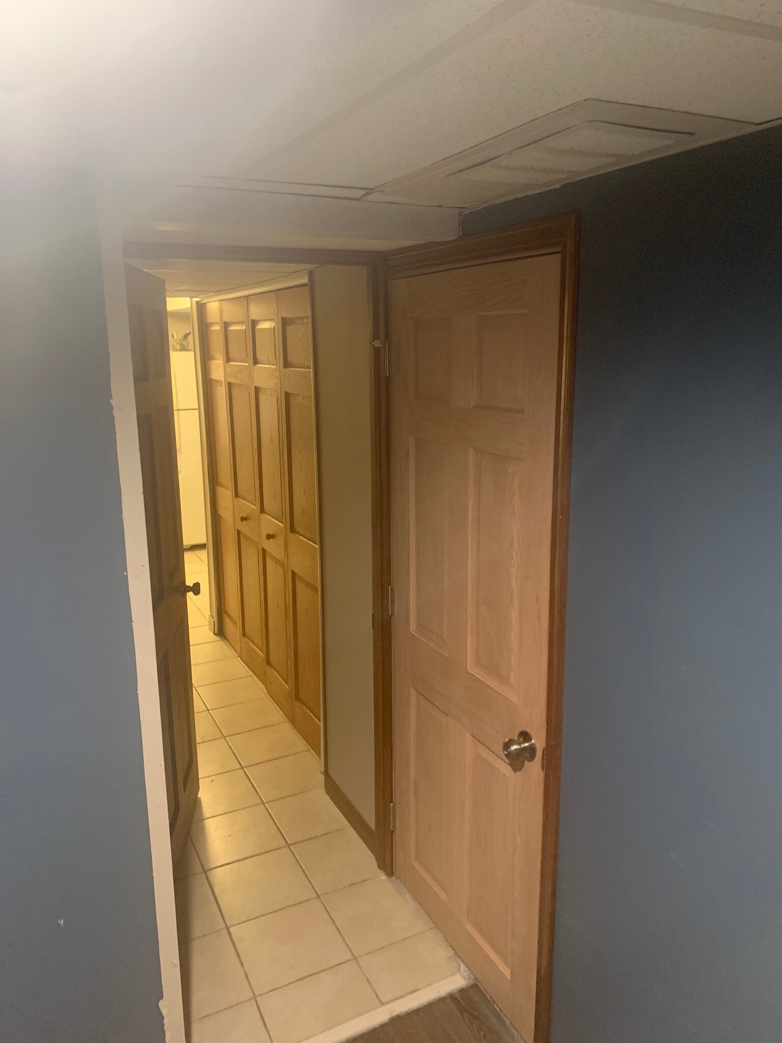 From Laundry room looking into Private Studio door open & closed door to the rest of the home - 1651 Dakota Ave S