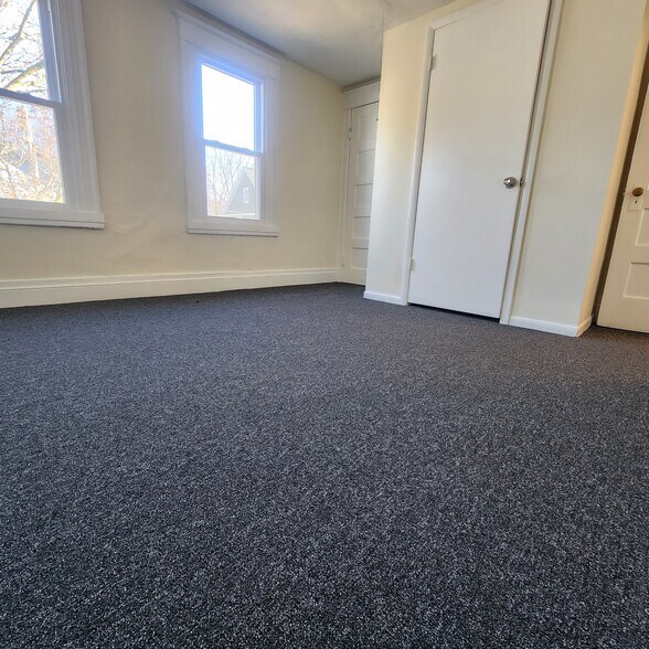 Front bedroom w/ closet - 113 Sterling St