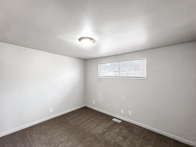 Building Photo - Spacious 5-Bedroom Home with Lofted Garage