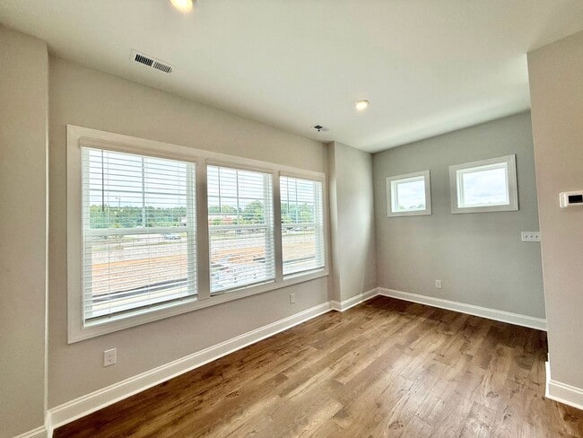 Building Photo - Stunning End Unit New Construction 3BD, 3....