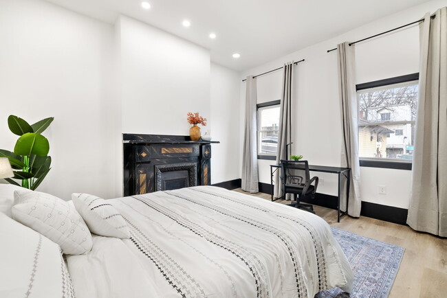 1st Floor Bedroom with office desk and outdoor windows - 10 Carrie St