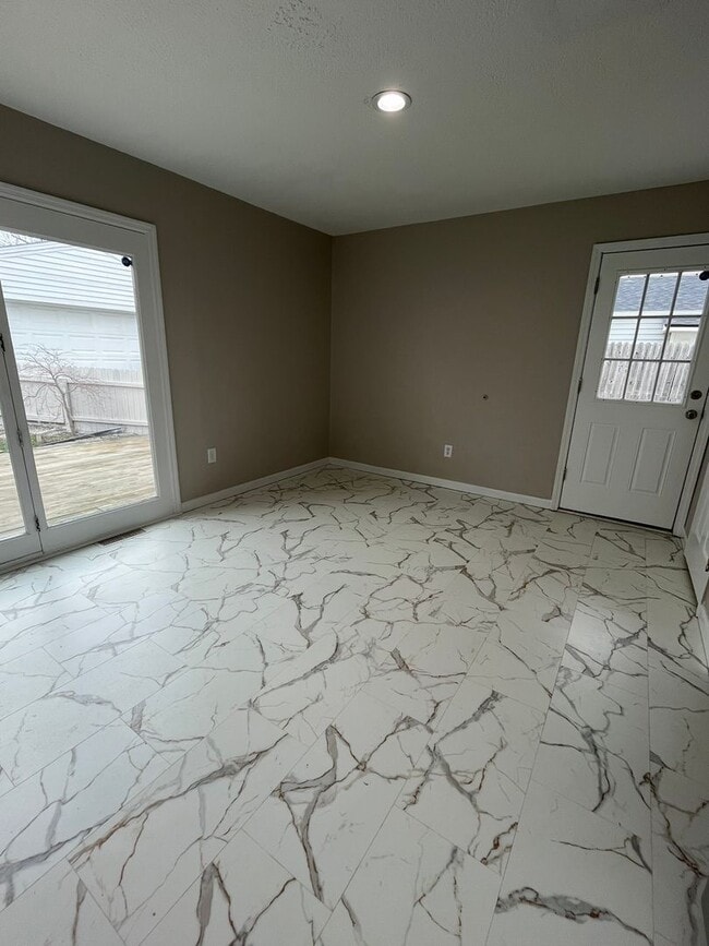 Building Photo - Spacious 3-Bedroom Ranch with 2-Car Garage & Oversized Fenced Backyard