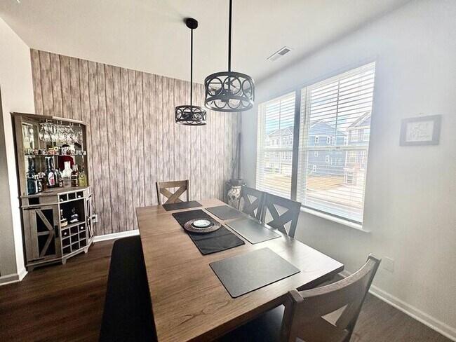 Building Photo - Scenic 3-Bed Townhome with Screened Porch, First Floor Storage & 1-Car Garage – Overlooking the G...