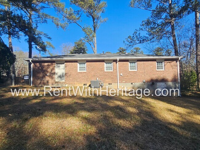 Building Photo - Great Brick Ranch / Harwood Floors / Huge Shop or Extra Storage / No Garage / Great Private Back ...