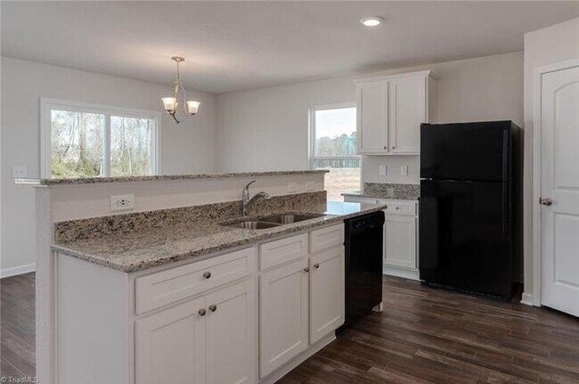 Building Photo - Spacious 3-Bedroom + Loft Home in Meredith Woods – Stylish, Efficient, and Perfect for Entertaining!