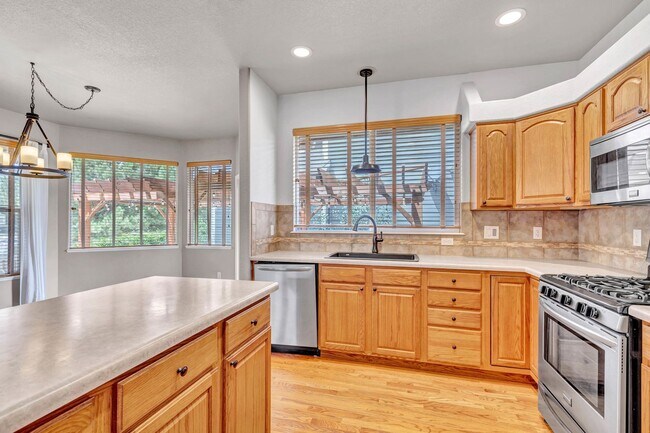 Building Photo - Beautiful Monument Ranch with Finished Basement & Low-Maintenance Living!