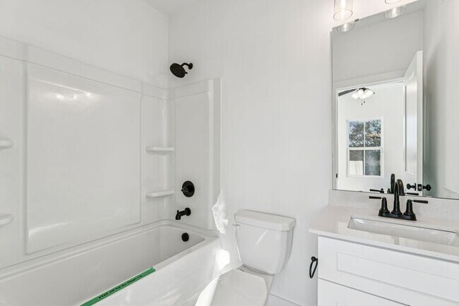 Building Photo - High-End 2BR Townhome | Rooftop Terrace + 2-Car Garage | 24-Unit Community